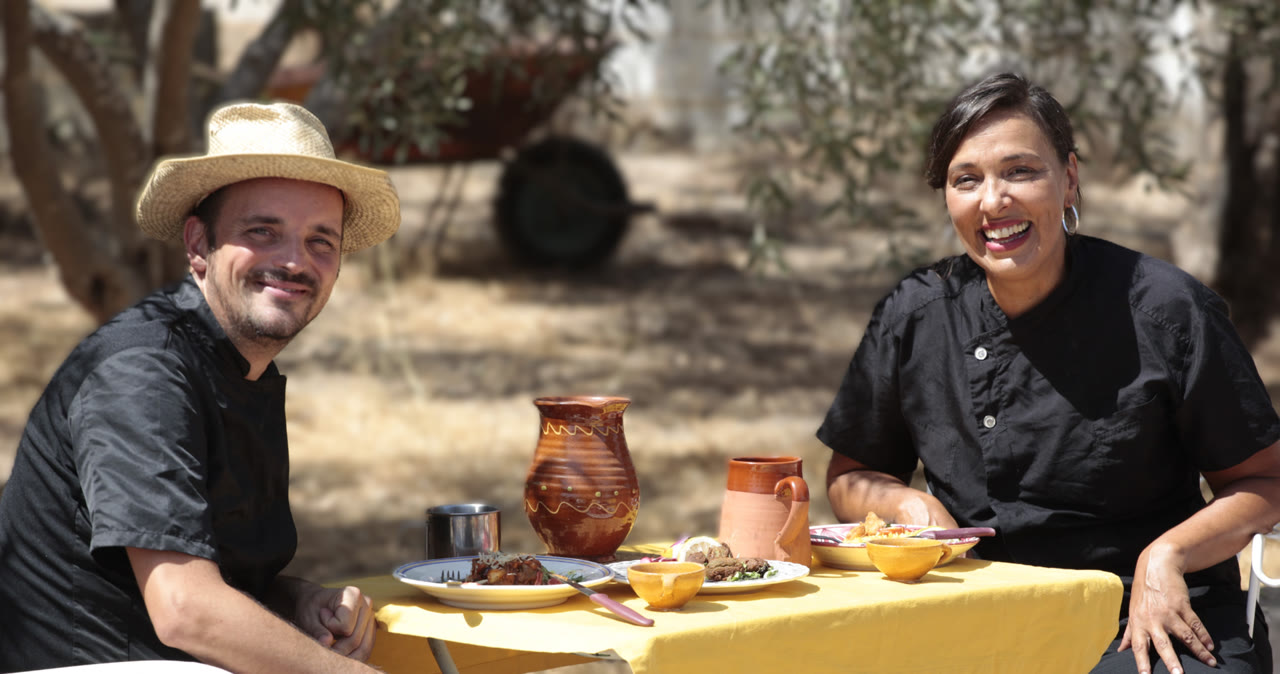 Portrait of the two Plant on Fire chefs at an outdoor table